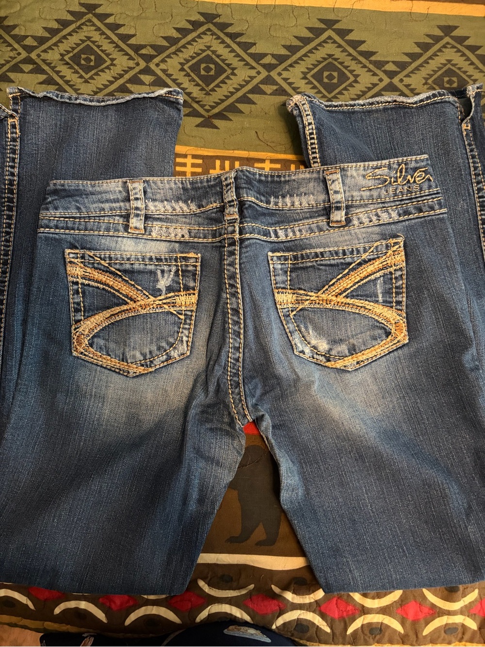 Silver Jeans TwistedWomen's Distressed Mid-Blue Bootcut with Embroidered Pockets